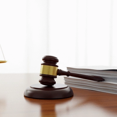 Gavel and legal documents on a table, symbolizing legal frameworks and justice